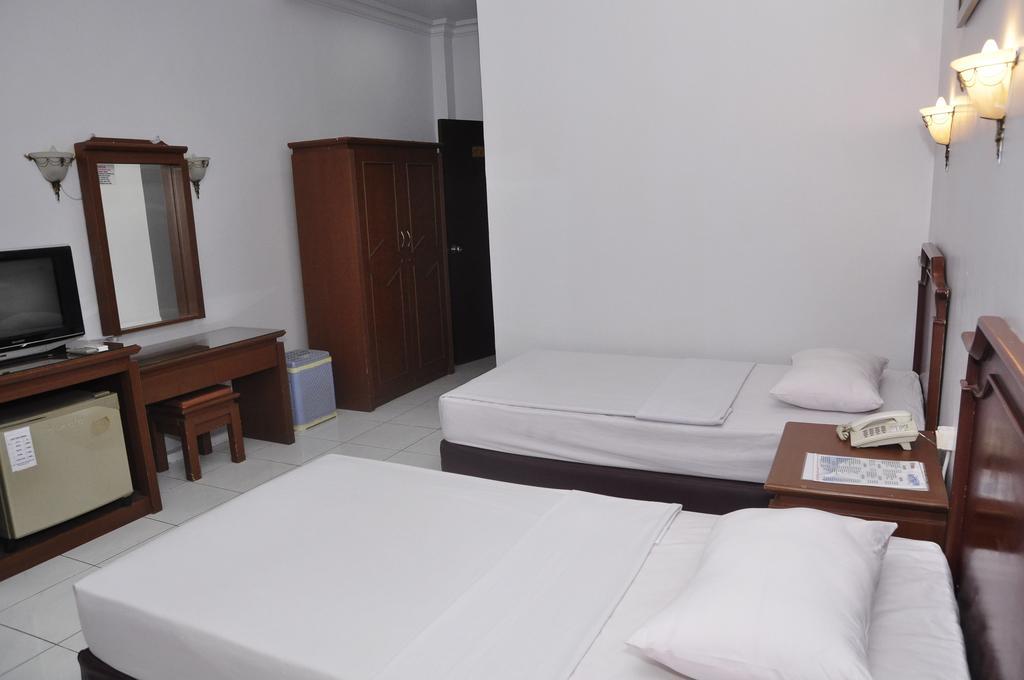 Hotel Andhika Syariah Samarinda Rum bild