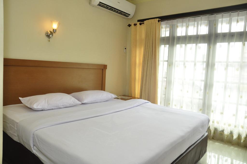 Hotel Andhika Syariah Samarinda Rum bild